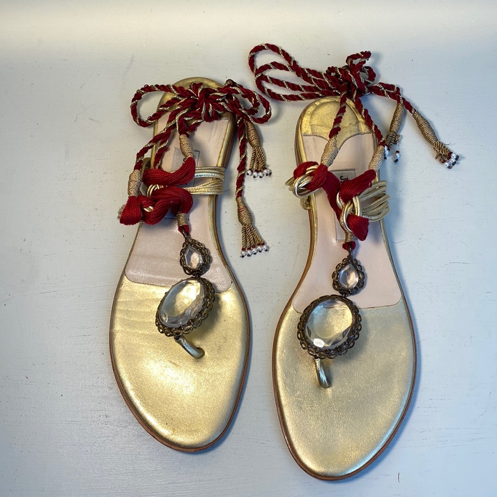 Jimmy Choo ornate sandal with wrap cords, medallions and beaded tassels.